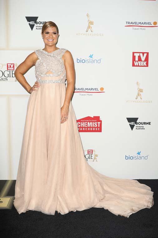 <p>Studio 10 host Sarah Harris was the belle of the ball in this dramatic George Elsissa gown with a sparkling crossover details top.</p>