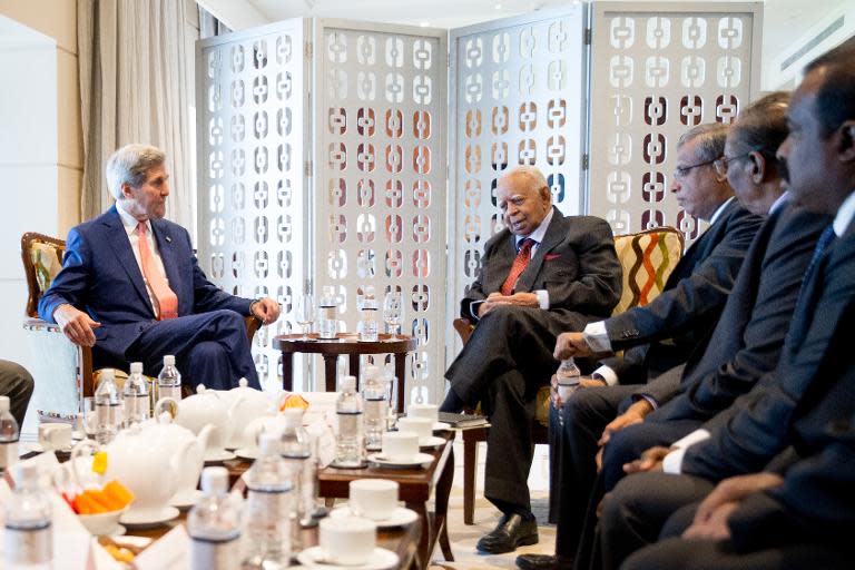 US Secretary of State John Kerry (L) speaks with Sri Lankan Tamil National Alliance (TNA) party leader Rajavarothiam Sampanthan (2nd L) in Colombo on May 3, 2015