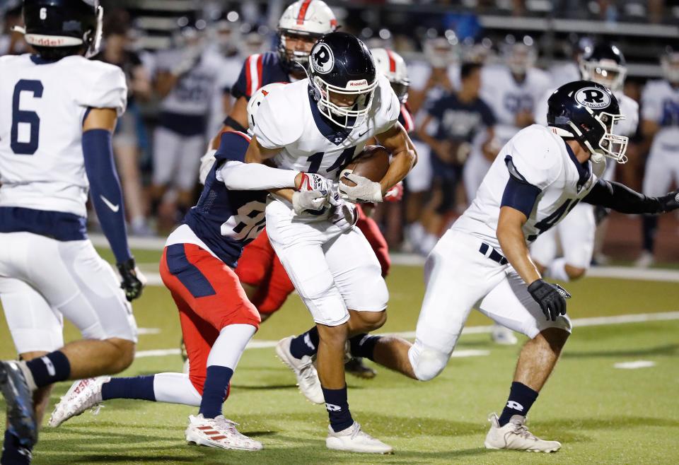 Redwood's Brandon Woodrow on a run against Tulare Western during a non-league high school football game at Bob Mathias Stadium in Tulare, Calif., Friday, Sept. 9, 2022.