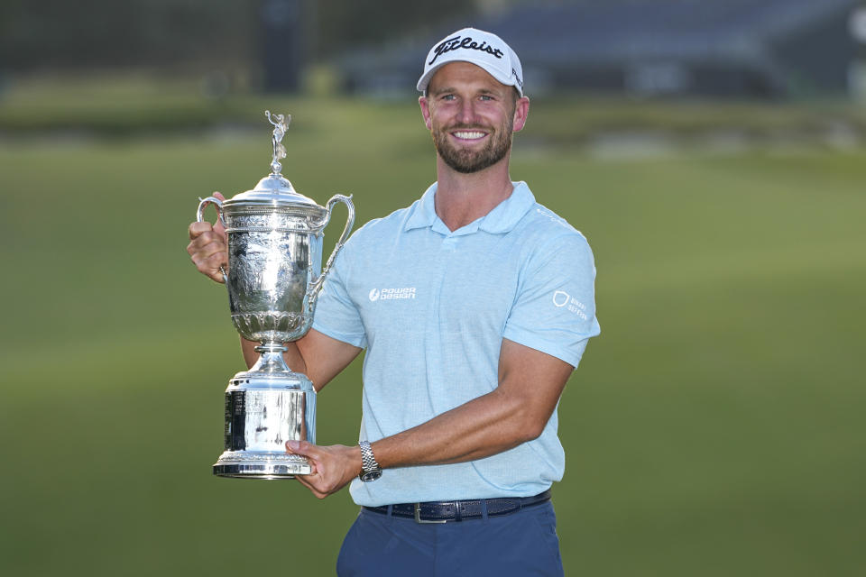 Wyndham Clark holds the trophy after winning after the U.S. Open golf tournament at Los Angeles Country Club on Sunday, June 18, 2023, in Los Angeles. (AP Photo/George Walker IV)