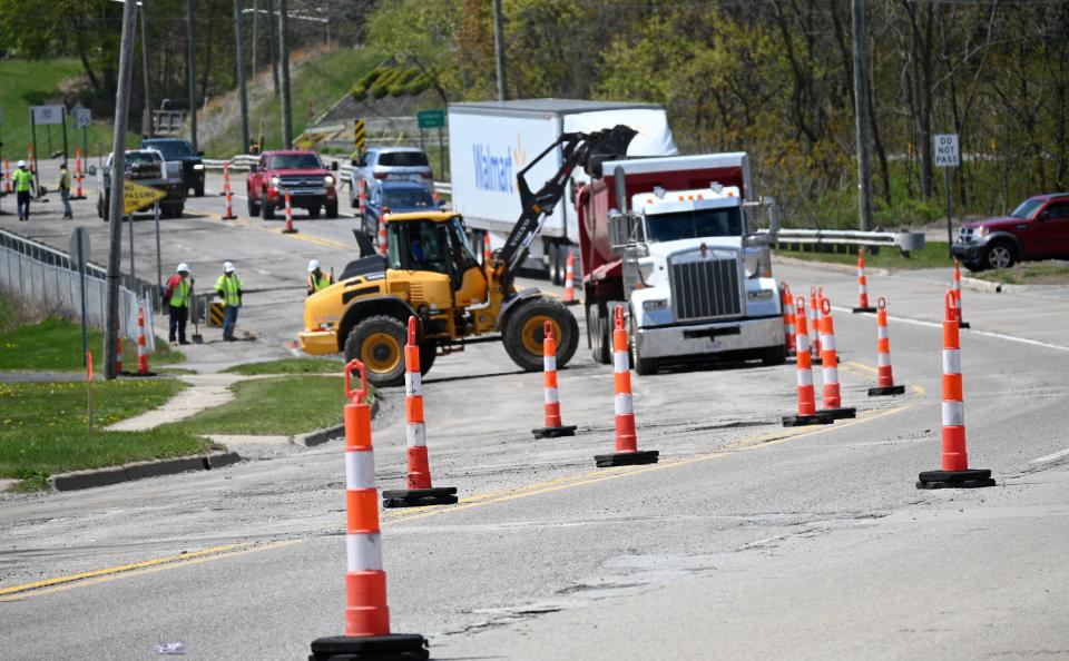 Friday construction crews began cleaning asphalt off the road and Coldwater bridge to begin a two-month reconstruction.