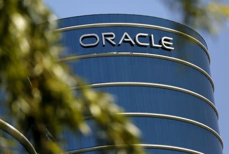 The Oracle logo is seen on its campus in Redwood City, California June 15, 2015. REUTERS/Robert Galbraith