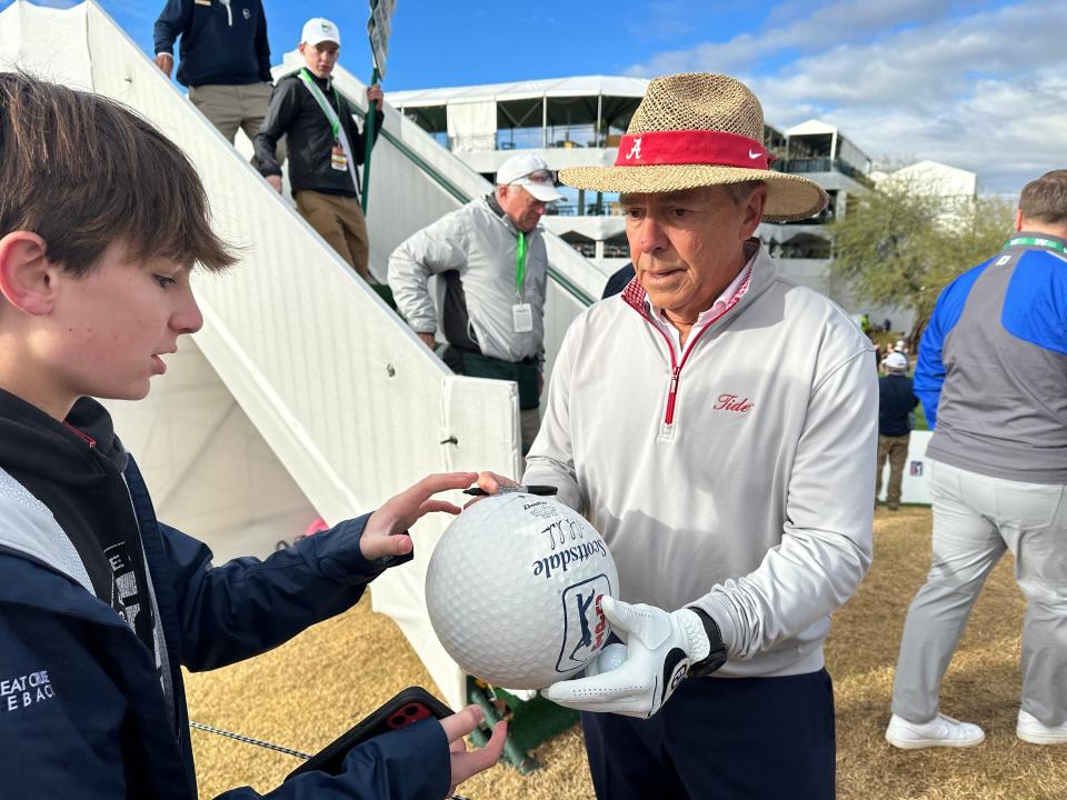 Former Alabama head football coach Nick Saban was a hit with golf fans and Crimson Tide fans Wednesday at the WM Phoenix Open's Pro-Am tournament.