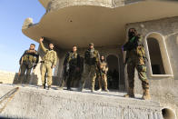 Turkish backed Syrian rebels enter the own of Saraqeb, in Idlib province, Syria, Thursday, Feb. 27, 2020. Turkey-backed Syrian opposition fighters Thursday retook a strategic northwestern town iof Saraqeb, opposition activists said, and cut off the key highway linking the capital, Damascus, with the northern city of Aleppo, days after the government reopened it for the first time since 2012. (AP Photo/Ghaith Alsayed)