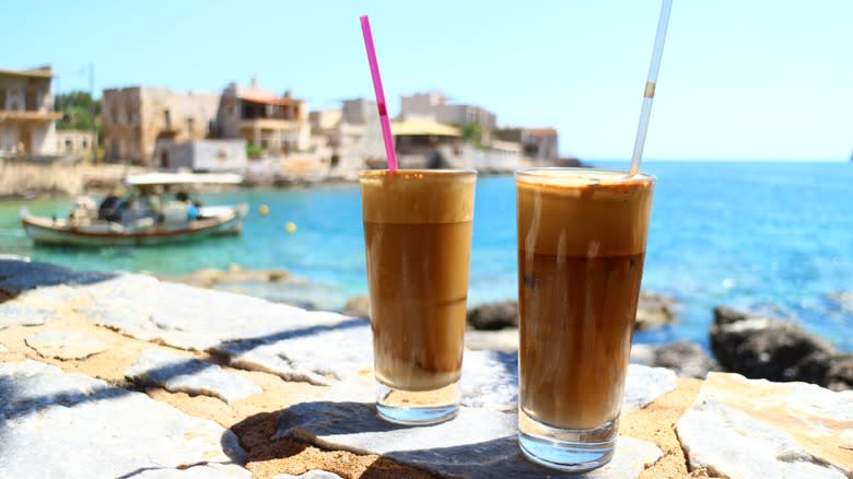 two frappes with greece backdrop