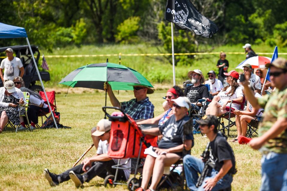 People listen to speakers during the 'Defend our 2A: Michigan’s Right for Self Preservation' event on Wednesday, July 19, 2023, at Freedom Farms in Ionia Township.