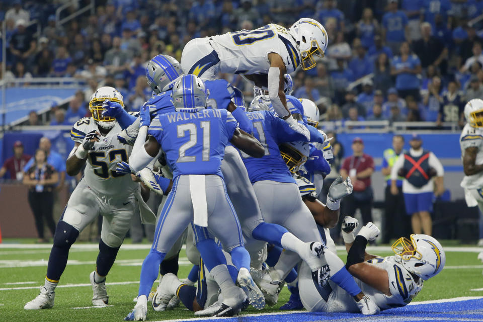 Los Angeles Chargers running back Austin Ekeler (30) scores on a one-yard touchdown run in the first half of an NFL football game against the Detroit Lions in Detroit, Sunday, Sept. 15, 2019. (AP Photo/Duane Burleson)