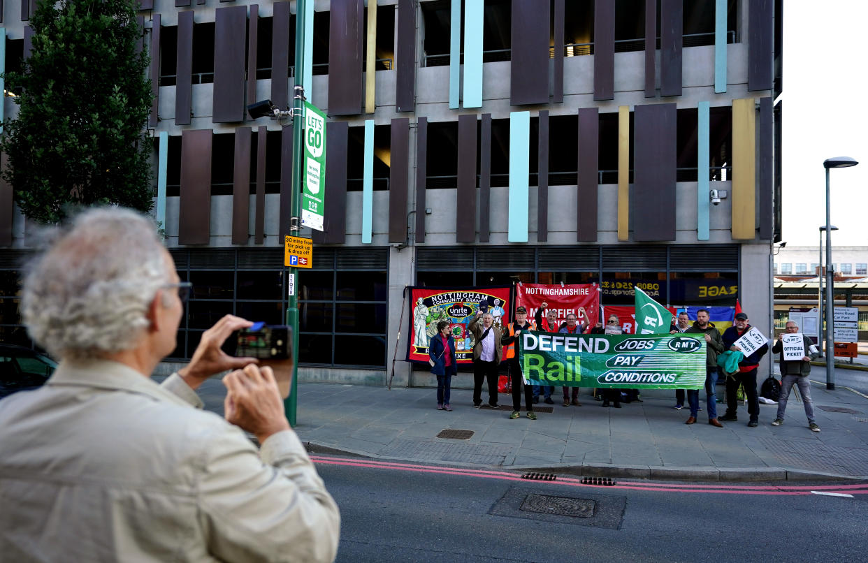 Striking rail staff form a picket at Nottingham Train Station, as members of the Rail, Maritime and Transport union begin their nationwide strike in a bitter dispute over pay, jobs and conditions. Picture date: Tuesday June 21, 2022.