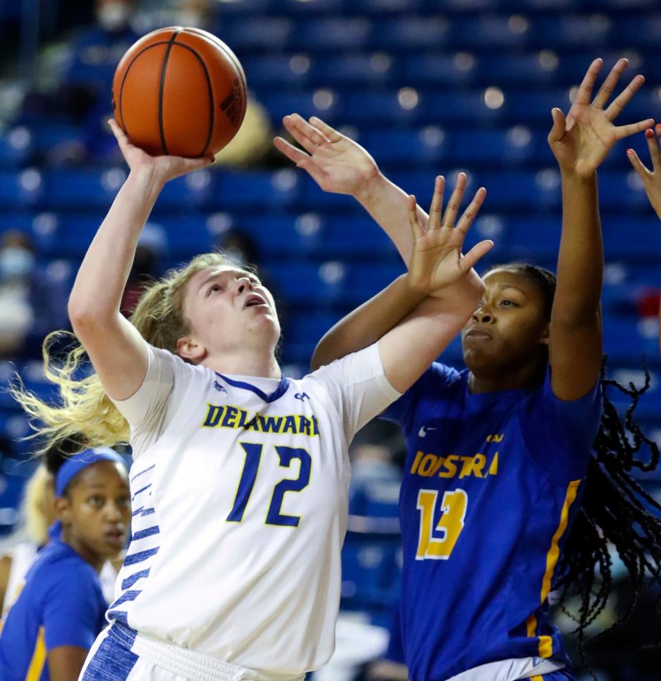 Delaware's Lizzie Oleary puts up a shot against Hofstra's Zyheima Swint in the first half of Delaware's 73-38 win at the Bob Carpenter Center, Friday, January 14, 2022.