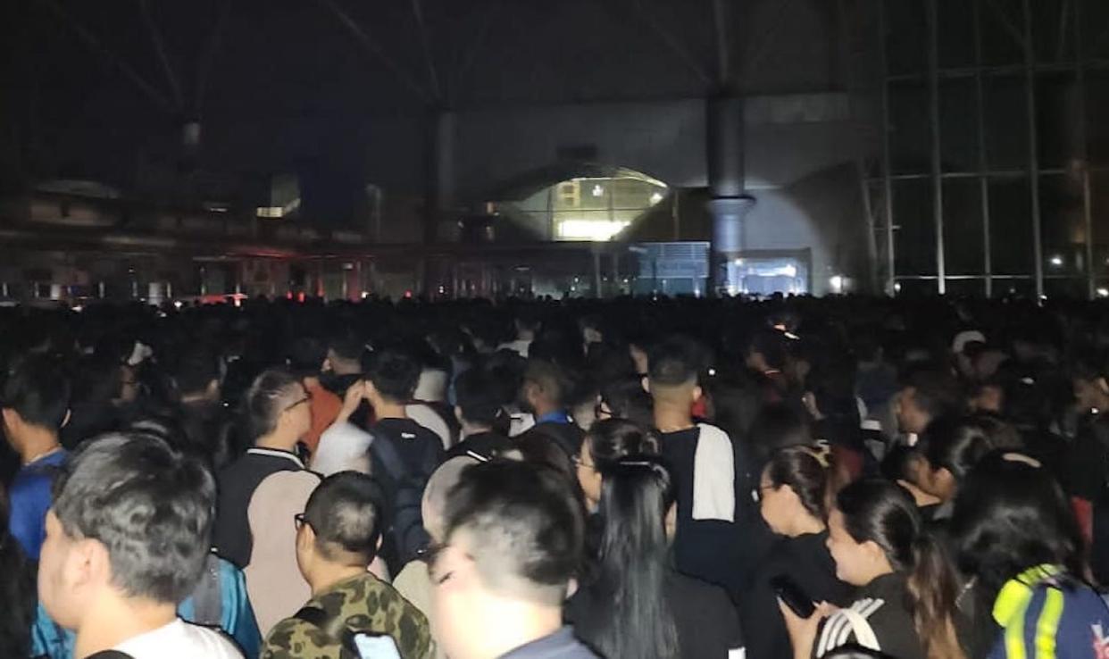 A crowd of people at the Johor immigration checkpoint.