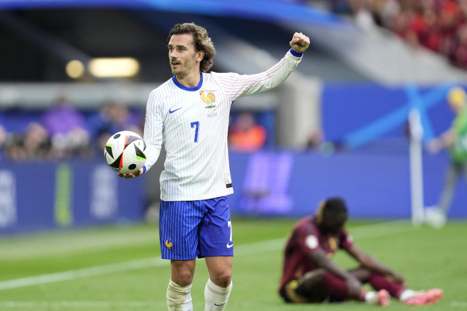 Antoine Griezmann of France celebrates at the end of a round of sixteen match between France and Belgium at the Euro 2024 soccer tournament in Duesseldorf, Germany, Monday, July 1, 2024. France won 1-0. (AP Photo/Darko Vojinovic)