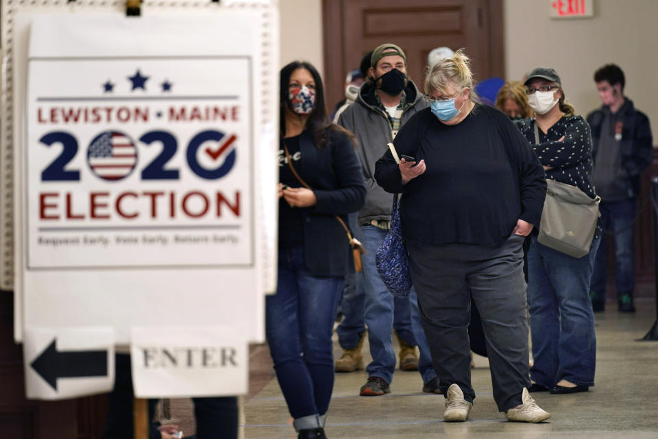 Residents wait to cast their absentee ballots during early voting, Friday, Oct. 30, 2020, in Lewiston, Maine. (AP Photo/Robert F. Bukaty)