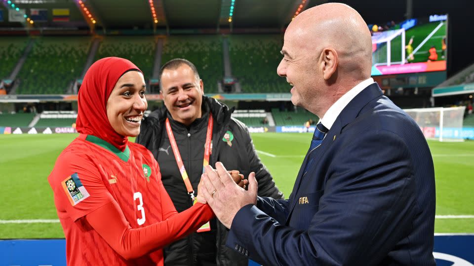 Nouhaila Benzina, pictured alongside FIFA President Gianni Infantino, has become a history maker during the Women's World Cup. - Harold Cunningham/FIFA/Getty Images