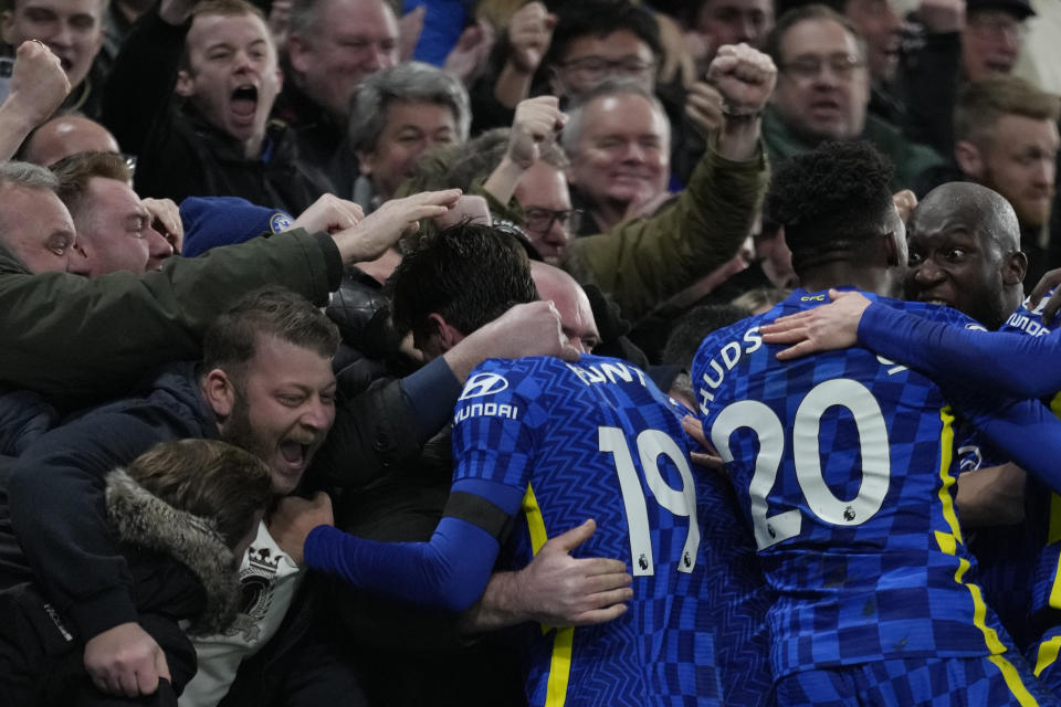 Chelsea players celebrate with their fans after Chelsea's Thiago Silva scored their side's second goal during the English Premier League soccer match between Chelsea and Tottenham Hotspur at Stamford Bridge stadium in London, England, Sunday, Jan. 23, 2022. (AP Photo/Kirsty Wigglesworth)