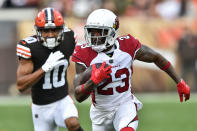 Arizona Cardinals cornerback Robert Alford (23) returns an interception trailed by Cleveland Browns wide receiver Anthony Schwartz (10) during the first half of an NFL football game, Sunday, Oct. 17, 2021, in Cleveland. (AP Photo/David Richard)