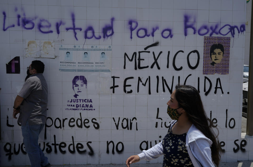 The walls outside a courthouse are filled with messages against femicide and in favor of freedom Roxana Ruiz, 22, during her hearing where she is charged with killing her attacker in Chimalhuacan, State of Mexico, Mexico, Monday, Abril 4, 2022. Ruiz said she killed a man who attacked, raped and threatened to kill her in 2021. She faces a charge of homicide with excess of legitimate self-defense. (AP Photo/Eduardo Verdugo)