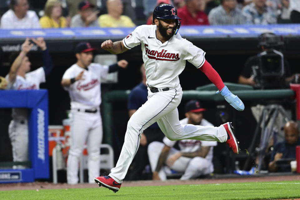 Cleveland Guardians' Amed Rosario scores on a double by Jose Ramirez against the Oakland Athletics during the seventh inning of a baseball game Tuesday, June 20, 2023, in Cleveland. (AP Photo/David Dermer)