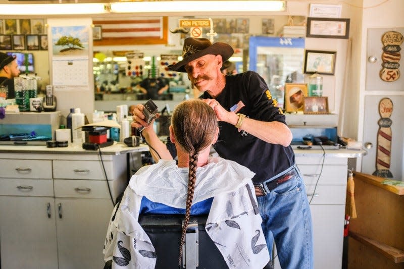 This photograph from Arthur Newberg is one      of scores he has captured in his eight-year project documenting the demise of American barbershops.