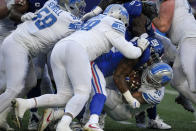 Detroit Lions running back Jamaal Williams (30) is tackled on the run during the second half of an NFL football game against the New York Giants, Sunday, Nov. 20, 2022, in East Rutherford, N.J. (AP Photo/Seth Wenig)
