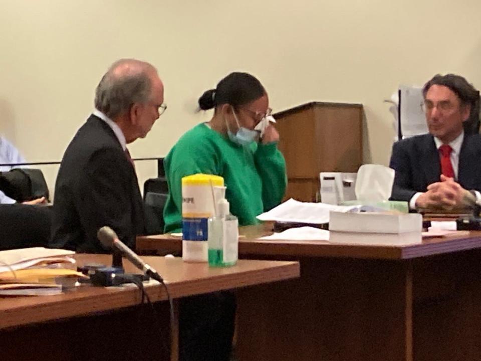 Yokauri Batista-Alcantara wipes tears while pleading guilty Monday to vehicular homicide and assault by auto in connection with a Thanksgiving 2021 wrong-way crash in which two children were killed and three other people were injured.