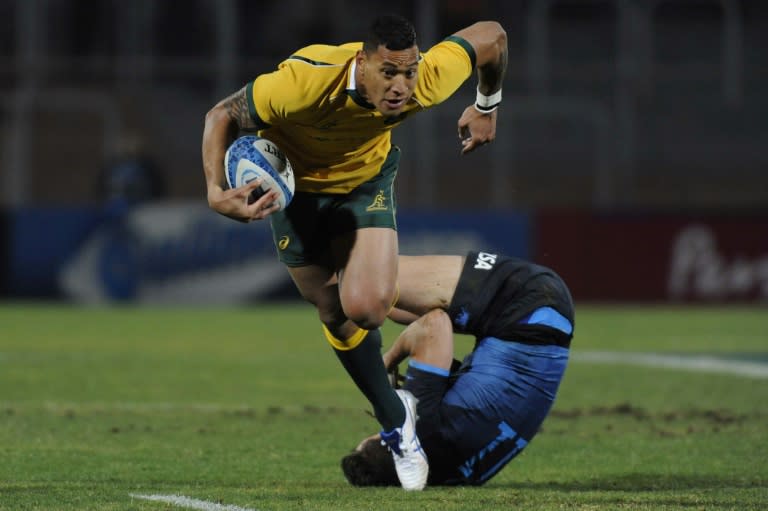 Australian Wallabies' Israel Folau (C) is tackled by Argentina's Juan Imhoff during their Rugby Championship Test match at Malvinas Argentinas stadium in Mendoza, on July 25, 2015