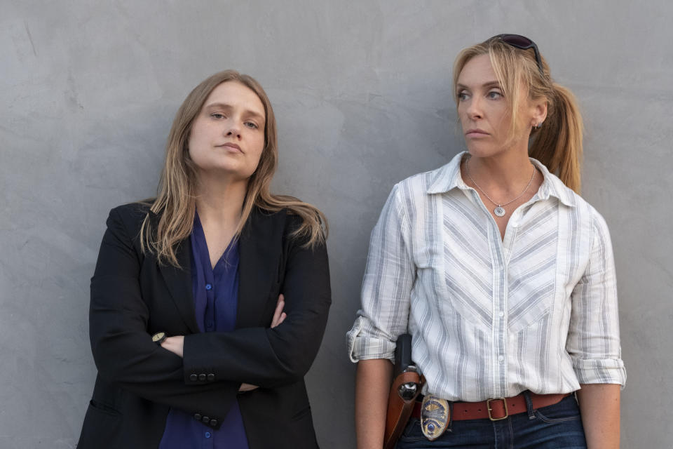 This image released by Netflix shows Merritt Wever, left, and Toni Collette in the true crime series "Unbelievable." The series was named one of the top ten TV shows of the year by the Associated Press. (Beth Dubber/Netflix via AP)