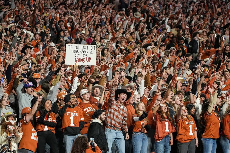 Texas fans cheer during the game against Texas Tech at Darrell K Royal Texas Memorial Stadium on Friday, Nov. 24, 2023.