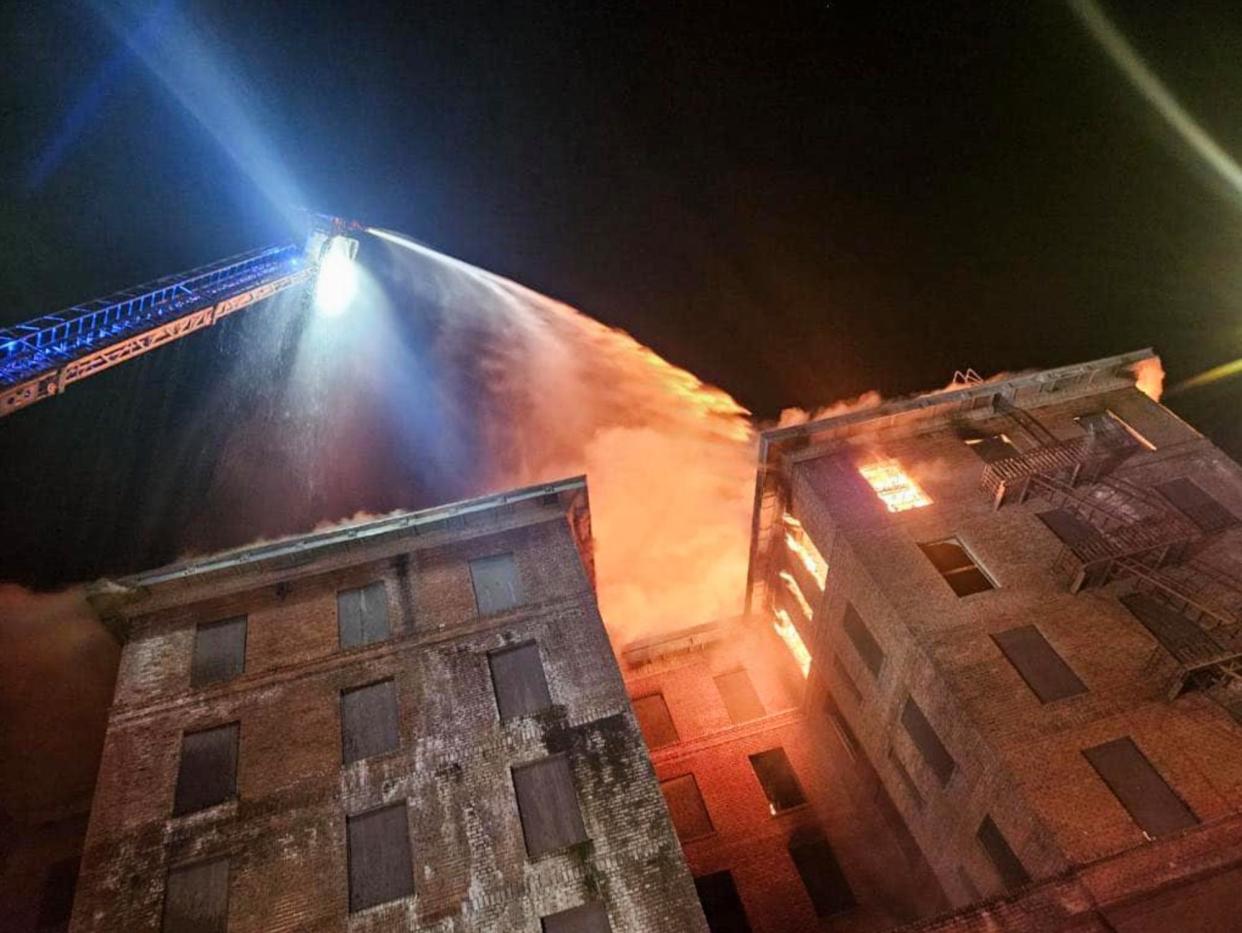 <span>Firefighters work to extinguish a blaze at the historic Hotel Marysville in Marysville, California, on 15 June 2024.</span><span>Photograph: Marysville Fire Department of California</span>
