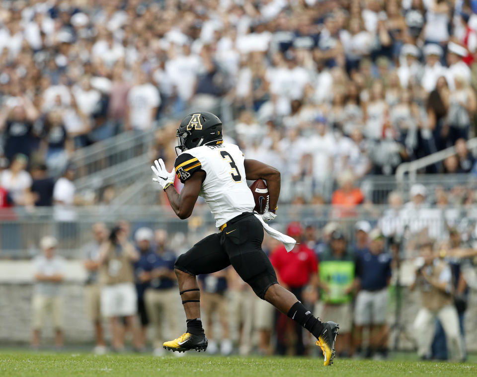 Appalachian State's Clifton Duck (4) runs back a kick for a 100 yards against Penn State during the first half of an NCAA college football game in State College, Pa., Saturday, Sept. 1, 2018. (AP Photo/Chris Knight)