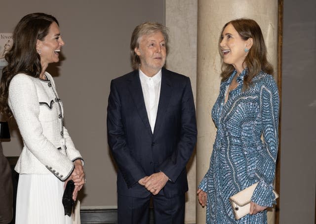 The Princess of Wales speaks with Sir Paul McCartney and his wife Nancy Shevell