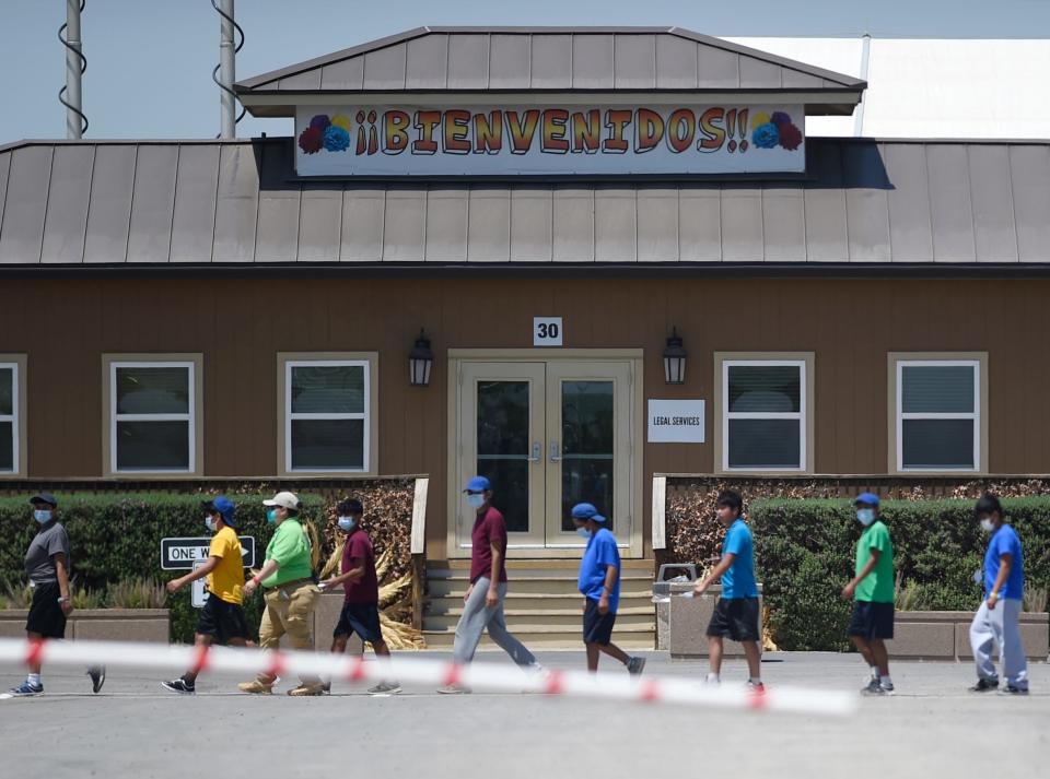 Migrant teenagers, who were unaccompanied when they were detained in the USA, stay at a U.S. Health and Human Services shelter in Carrizo Springs, Texas, during their vetting process.