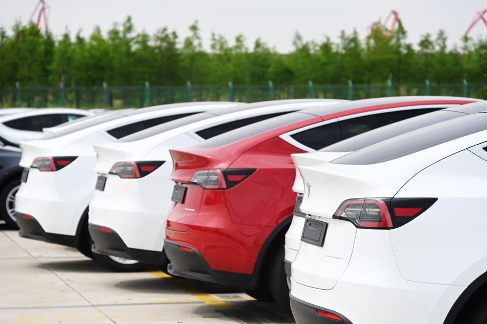 SHANGHAI, CHINA - MAY 15: A total of 4,027 Tesla Model Y and Model 3 electric vehicles, which will be sent to the Port of Zeebrugge in Belgium, wait to be loaded on board the roll-on-roll-off cargo vessel Theben operated by Wallenius Wilhelmsen at Nangang port on May 15, 2022 in Shanghai, China. (Photo by Shen Chunchen/VCG via Getty Images)