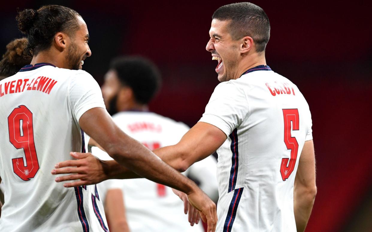 England's Conor Coady (right) celebrates scoring his side's second goal of the game with Dominic Calvert-Lewin - PA