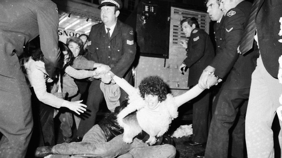 Protestors calling for gay and lesbian rights clash with police officers during the Mardi Gras march on Oxford Street in Sydney on International Homosexual Solidarity Day on June 24, 1978. - John Sefton/Newspix/Getty Images