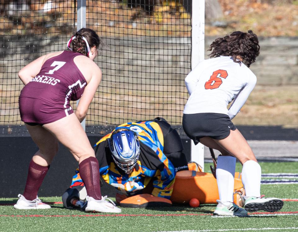 Audrey Adrorno of Mamaroneck battles Orchard Park defenders in front of the goal during the New York State Class A Field Hockey championship at Centereach High School on Long Island Nov. 12, 2023. Mamaroneck defeated Orchard Park 4-0 to win the state championship.