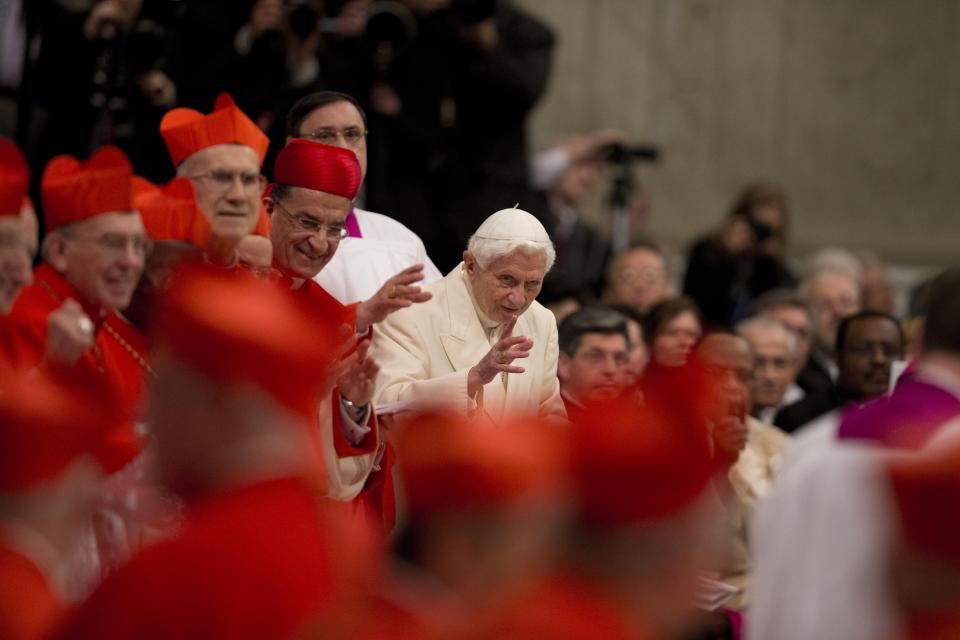 FILE - Pope Emeritus Benedict XVI attends a consistory led by Pope Francis inside St. Peter's Basilica at the Vatican on Feb. 22, 2014. Pope Emeritus Benedict XVI, the German theologian who will be remembered as the first pope in 600 years to resign, has died, the Vatican announced Saturday. He was 95. (AP Photo/Alessandra Tarantino, File)