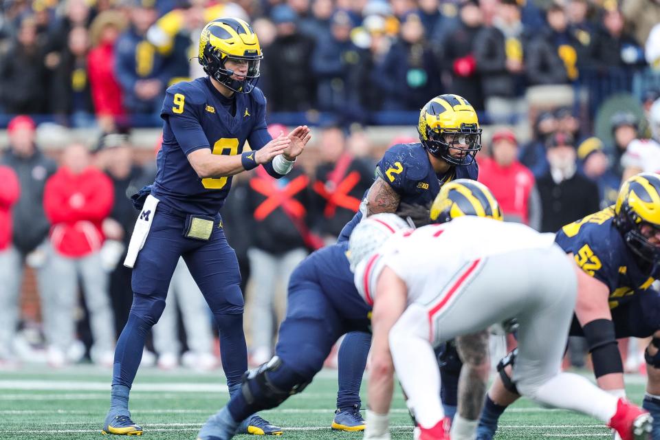 Michigan quarterback J.J. McCarthy calls for the snap at the line of scrimmage as running back Blake Corum looks on during the second half at Michigan Stadium in Ann Arbor on Saturday, Nov. 25, 2023.