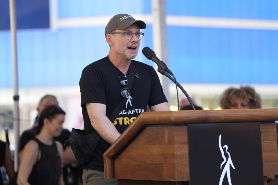 Actor Christian Slater speaks during the SAG-AFTRA "Rock the City for a Fair Contract" rally in Times Square on Tuesday, July 25, 2023, in New York. The actors strike comes more than two months after screenwriters began striking in their bid to get better pay and working conditions. (Photo by Charles Sykes/Invision/AP)