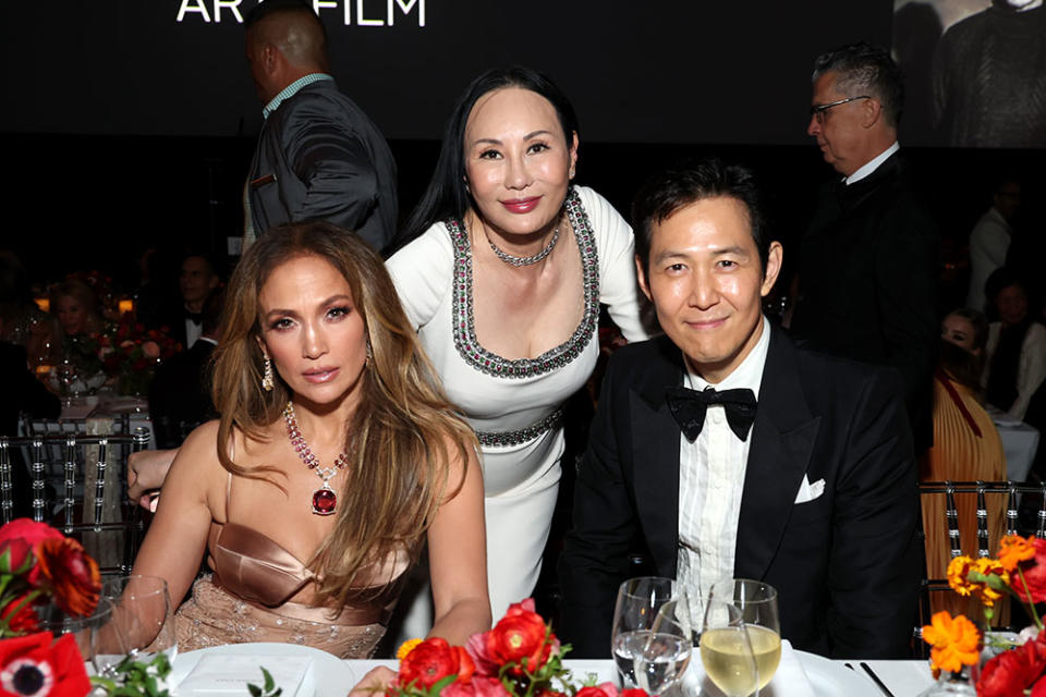 (L-R) Jennifer Lopez, wearing Gucci, LACMA Art + Film Gala Co-Chair Eva Chow, wearing Gucci, and Lee Jung-jae, wearing Gucci, attend the 2023 LACMA Art+Film Gala