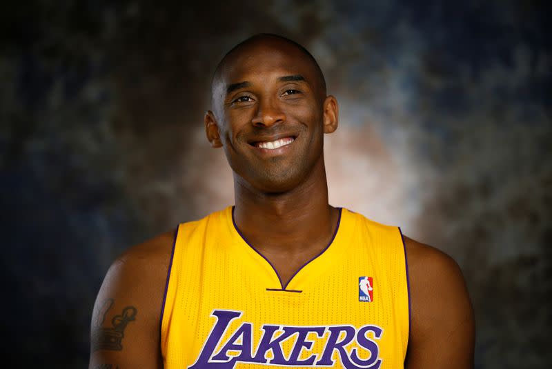 FILE PHOTO: Lakers guard Kobe Bryant smiles during an interview at NBA media day for the Los Angeles Lakers basketball team in Los Angeles