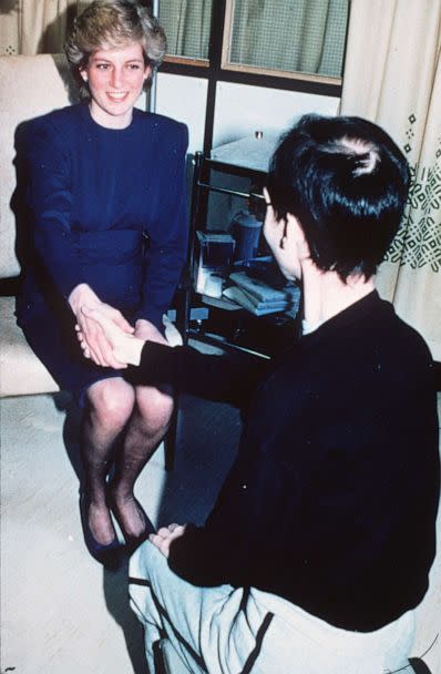 PHOTO: Diana, Princess of Wales shakes hands with an Aids victim as she opens a new Aids ward at the Middlesex Hospital on April 9, 1987 in London. (Anwar Hussein/WireImage via Getty Images, FILE)