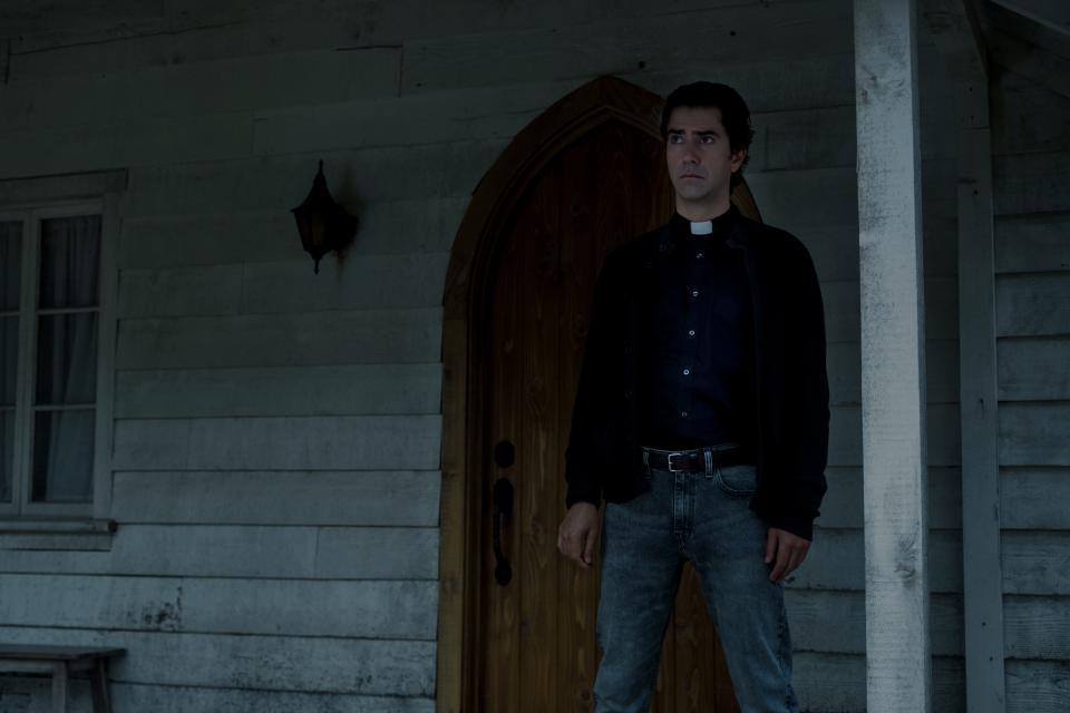 Father Paul (Hamish Linklater) is a man of many secrets who brings a monster to Crockett Island in "Midnight Mass."