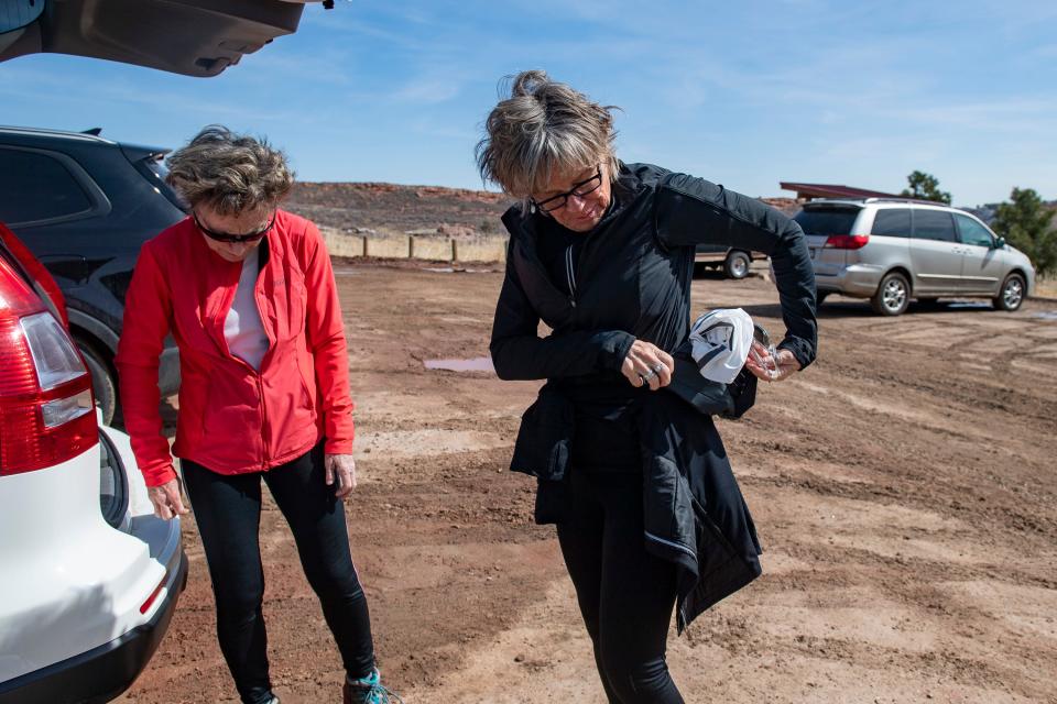 Fort Collins residents Lori Stromberger, left, and Sue Williams unpack at their vehicle at Lory State Park near Fort Collins on March 18 after completing the Mills Creek Trail to Horsetooth Rock Trail.