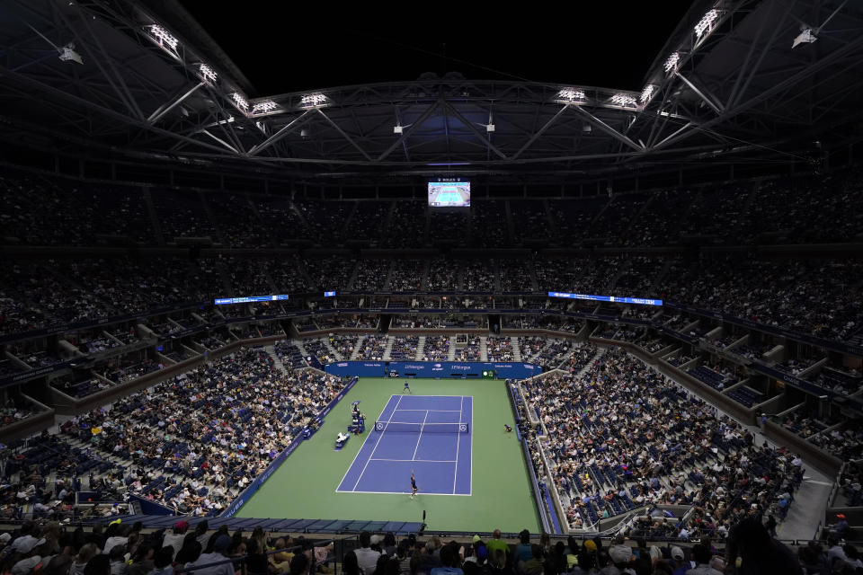 Holger Vitus Nodskov Rune of Denmark, bottom, serves to Novak Djokovic, of Serbia, during the first round of the US Open tennis championships, Tuesday, Aug. 31, 2021, in New York. (AP Photo/Frank Franklin II)