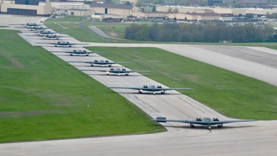 B-2 stealth bombers assigned to the 509th Bomb Wing taxi on the runway at Whiteman Air Force Base on April 15, 2024. The base executed a mass fly-off of 12 B-2s to cap off the annual Spirit Vigilance exercise. <em>U.S. Air Force photo by Airman 1st Class Hailey Farrell</em> <em>U.S. Air Force photo by Airman 1st Class Hailey Farrell</em>