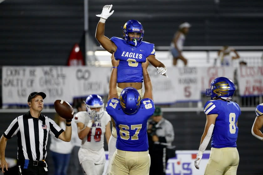 MISSION VIEJO, CA - SEPTEMBER 17: Tight end Nicholas Lopez (6), is hoisted up in the air by Kilian O'connor.