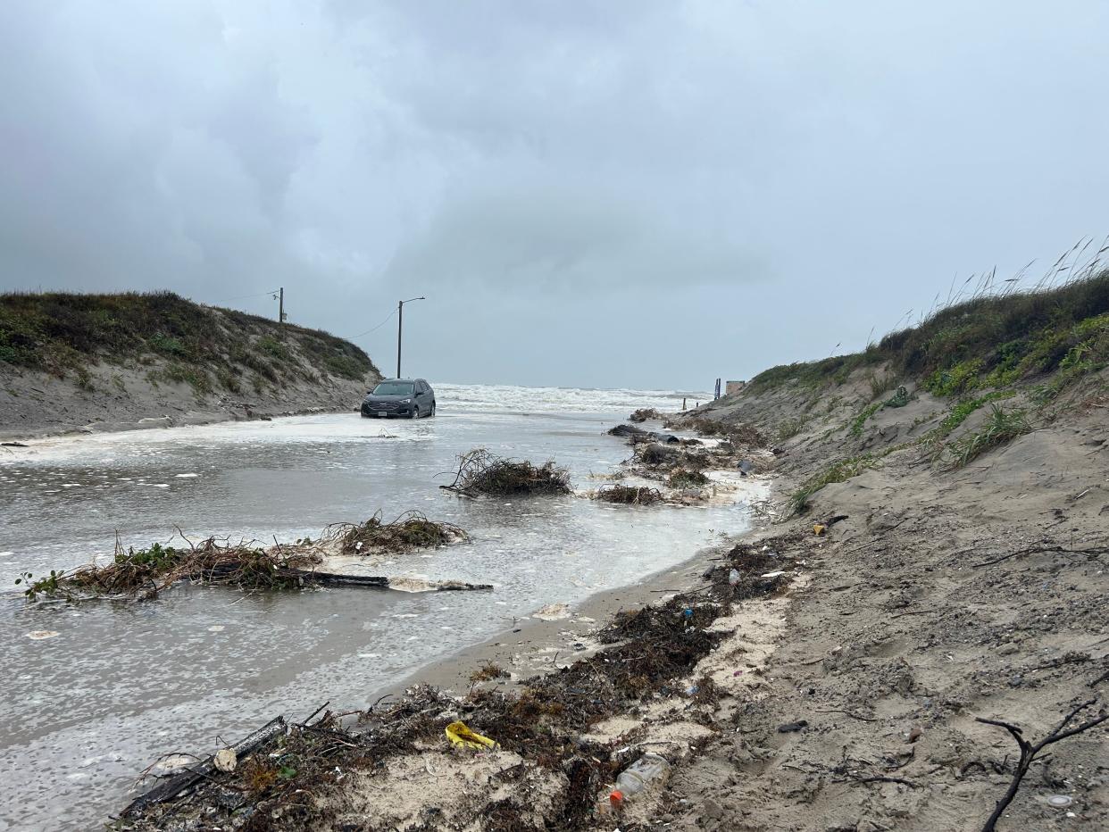 A car on Access Road 6 near Padre Balli Park on North Padre Island was inundated Wednesday morning, June 19, 2024, as stormwater runoff and high tides flooded the area.