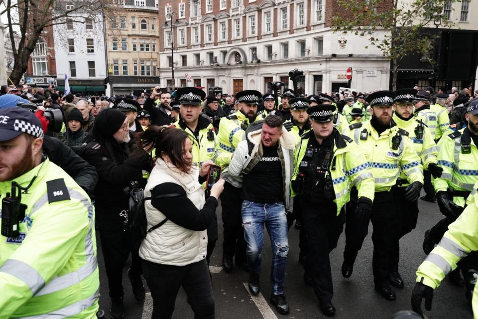 Robinson was led away by a number of officers (Jordan Pettitt/PA Wire)