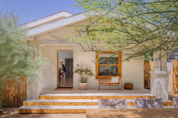 At the front of the main house, architect Danny Lim framed one of the original windows with new trim to give it a more modern feel and installed limestone on the porch and steps.