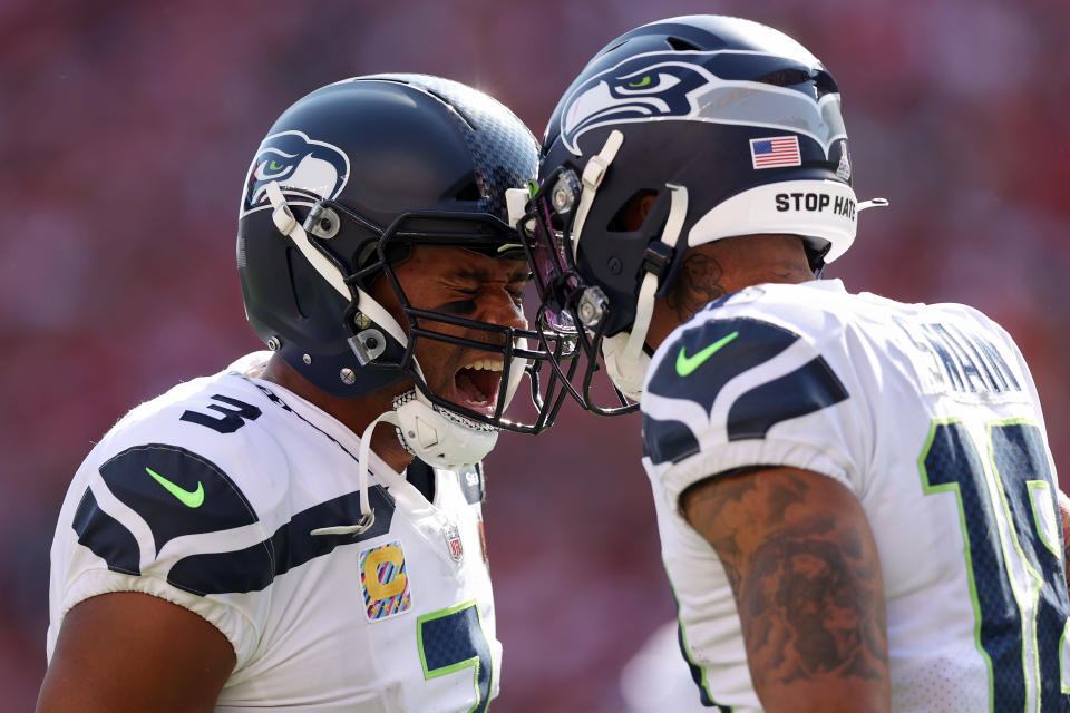 Freddie Swain (18) of the Seattle Seahawks celebrates a touchdown with Russell Wilson. (Photo by Ezra Shaw/Getty Images)